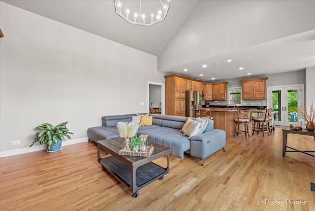 7530 Inverway Dr, Lakewood, IL 60014 - living room with light wood-style flooring, high vaulted ceiling, baseboards, recessed lighting, and a chandelier