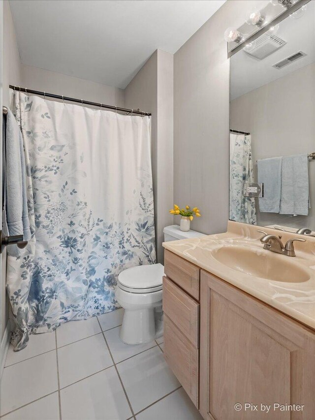 7530 Inverway Dr, Lakewood, IL 60014 - bathroom with toilet, vanity, and tile patterned floors