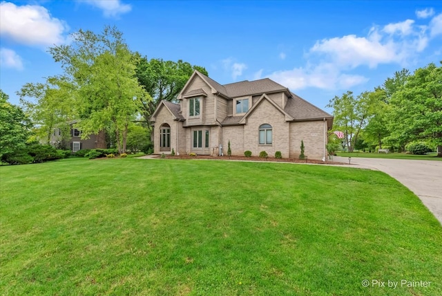 7530 Inverway Dr, Lakewood, IL 60014 - traditional home featuring a front lawn, brick siding, and a shingled roof