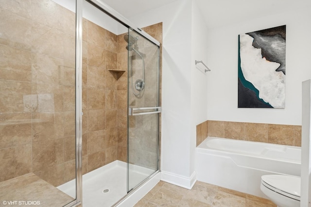 1001 W Madison St Unit 211, Chicago, IL 60607 - bathroom featuring a stall shower, toilet, a garden tub, baseboards, and tile patterned flooring