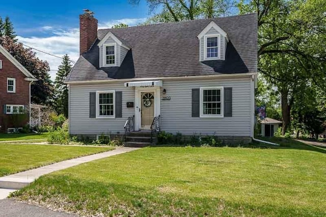 3803 Charles St, Rockford, IL 61108 - new england style home with a front yard and a chimney