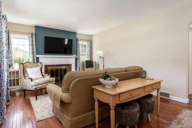 3803 Charles St, Rockford, IL 61108 - living room featuring wood-type flooring, a fireplace, and baseboards