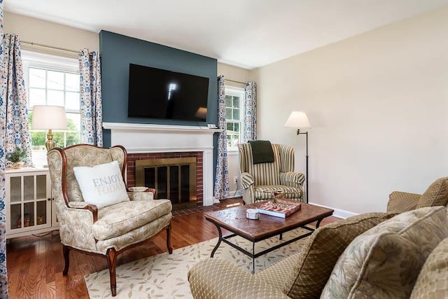 3803 Charles St, Rockford, IL 61108 - living room with plenty of natural light, wood finished floors, and a brick fireplace