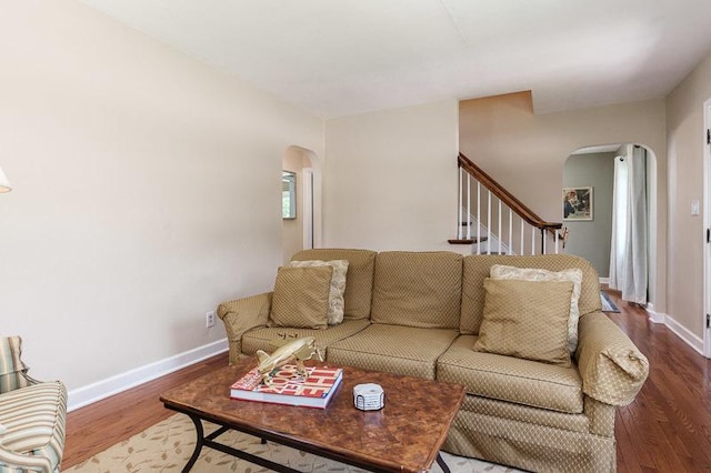 3803 Charles St, Rockford, IL 61108 - living room with arched walkways, wood finished floors, baseboards, and stairs