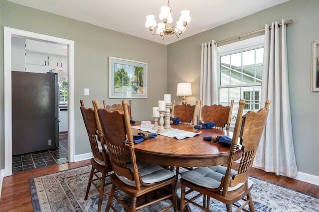 3803 Charles St, Rockford, IL 61108 - dining room with a chandelier, wood finished floors, and plenty of natural light