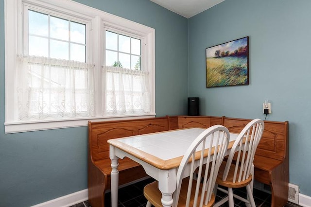 3803 Charles St, Rockford, IL 61108 - dining room with baseboards and plenty of natural light
