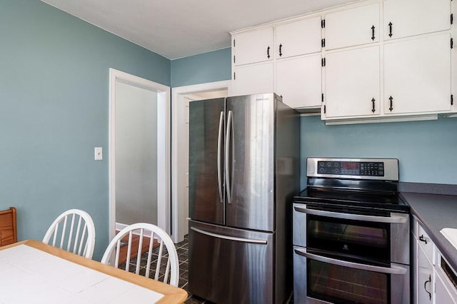 3803 Charles St, Rockford, IL 61108 - kitchen featuring stainless steel appliances and white cabinetry