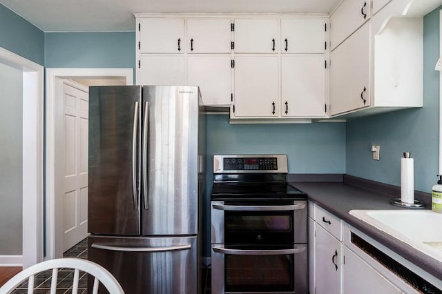 3803 Charles St, Rockford, IL 61108 - kitchen with stainless steel appliances and white cabinets