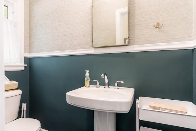 3803 Charles St, Rockford, IL 61108 - bathroom featuring toilet, baseboards, and a sink