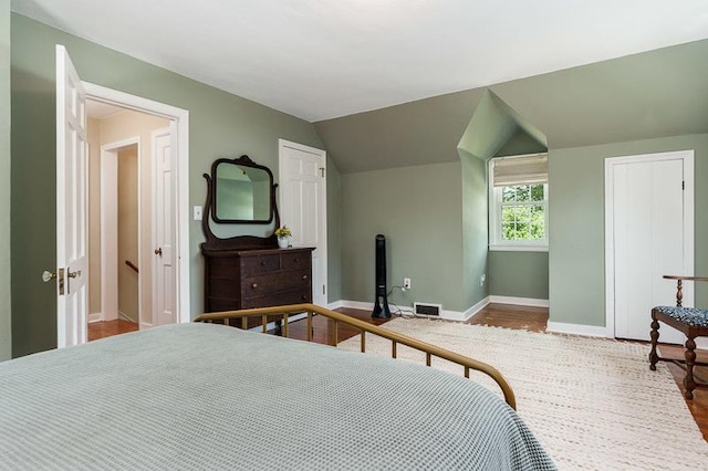 3803 Charles St, Rockford, IL 61108 - bedroom with baseboards, wood finished floors, and vaulted ceiling