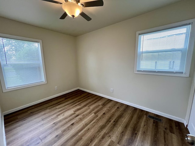 2422 E Washington St, Urbana, IL 61802 - unfurnished room featuring wood finished floors and ceiling fan