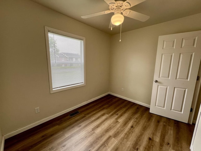 2422 E Washington St, Urbana, IL 61802 - empty room featuring wood finished floors and a ceiling fan