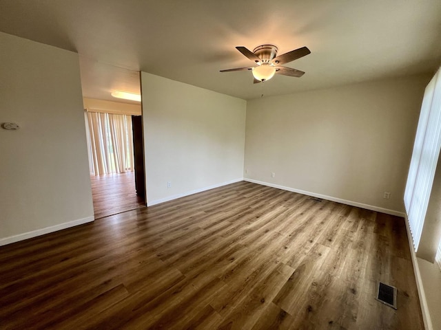 2422 E Washington St, Urbana, IL 61802 - unfurnished room with a ceiling fan and dark wood finished floors