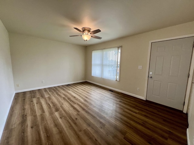 2422 E Washington St, Urbana, IL 61802 - spare room with ceiling fan and dark wood-style flooring