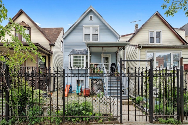 4331 W Mclean Ave, Chicago, IL 60639 - view of front facade featuring covered porch, a chimney, and a gate