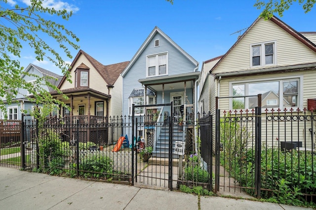 4331 W Mclean Ave, Chicago, IL 60639 - view of front facade with a porch, a gate, and a fenced front yard