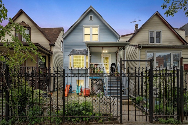 4331 W Mclean Ave, Chicago, IL 60639 - view of front of property featuring covered porch, a fenced front yard, and a gate