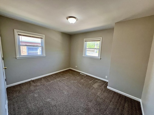 17415 Burnham Ave, Lansing, IL 60438 - spare room with dark colored carpet and baseboards