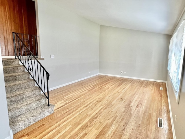 17415 Burnham Ave, Lansing, IL 60438 - unfurnished room featuring light wood-type flooring, baseboards, and stairway