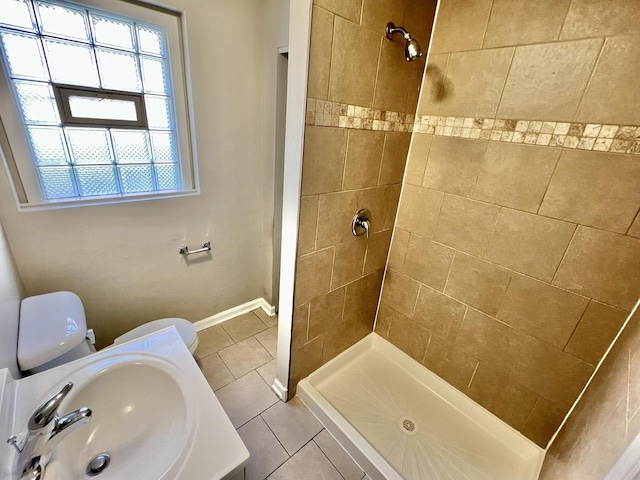 17415 Burnham Ave, Lansing, IL 60438 - full bathroom featuring a sink, tiled shower, tile patterned flooring, and toilet