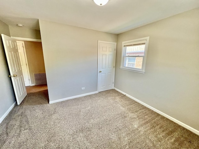 17415 Burnham Ave, Lansing, IL 60438 - unfurnished bedroom with baseboards and carpet floors