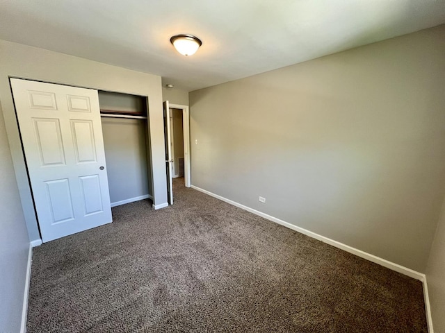 17415 Burnham Ave, Lansing, IL 60438 - unfurnished bedroom featuring carpet flooring, baseboards, and a closet