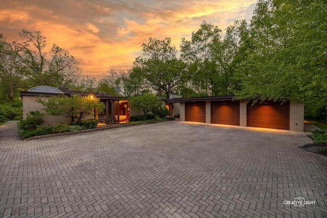 5N477 Curling Pond Rd, Wayne, IL 60184 - view of front of property with driveway, a garage, and brick siding