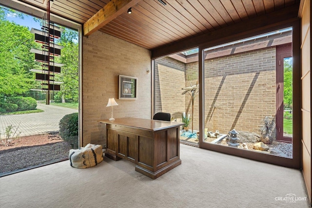 5N477 Curling Pond Rd, Wayne, IL 60184 - carpeted home office featuring healthy amount of natural light, brick wall, a wooden ceiling with exposed beams, and expansive windows