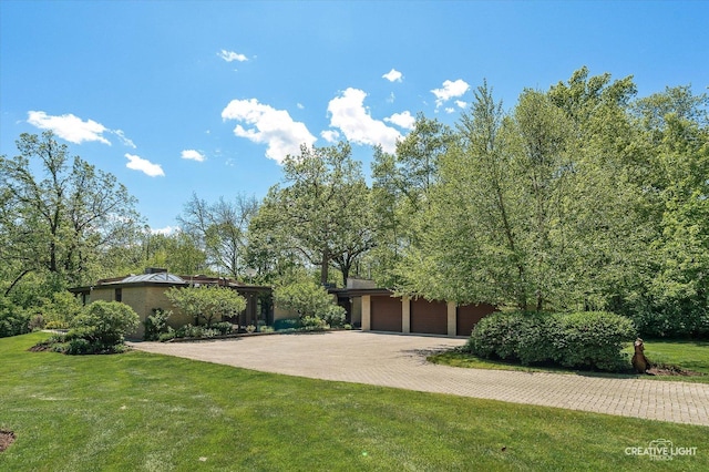 5N477 Curling Pond Rd, Wayne, IL 60184 - view of grassy yard with driveway and a garage
