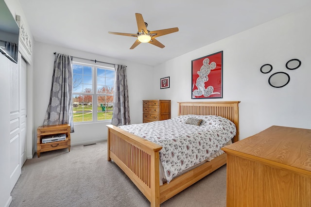 814 Glory Ct, Shorewood, IL 60404 - bedroom with light colored carpet, a closet, baseboards, and ceiling fan