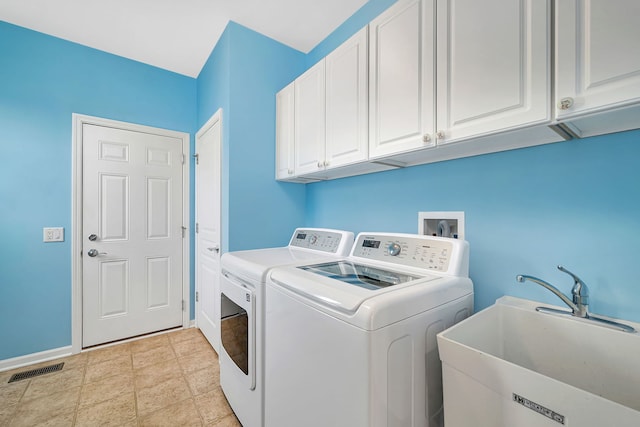 814 Glory Ct, Shorewood, IL 60404 - laundry room featuring cabinet space, washer and dryer, baseboards, and light stone finish floors