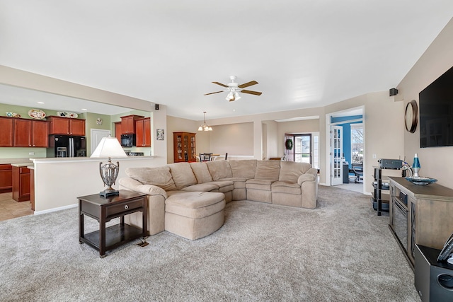 814 Glory Ct, Shorewood, IL 60404 - living room with light colored carpet, a ceiling fan, and a chandelier