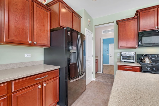 814 Glory Ct, Shorewood, IL 60404 - kitchen with black appliances, light countertops, and light tile patterned flooring