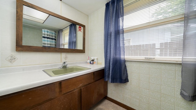 113 Maple Ave, Mount Morris, IL 61054 - bathroom with tile walls and vanity