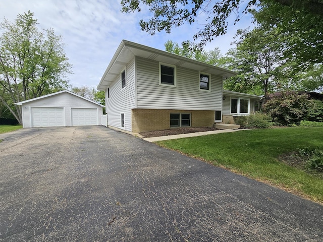 5S426 Columbia St, Naperville, IL 60563 - tri-level home with an outbuilding, a detached garage, a front lawn, and brick siding