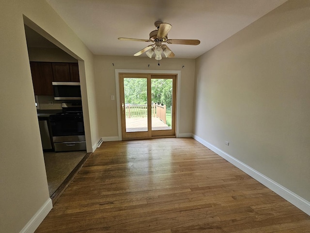 5S426 Columbia St, Naperville, IL 60563 - entryway with wood finished floors, ceiling fan, and baseboards