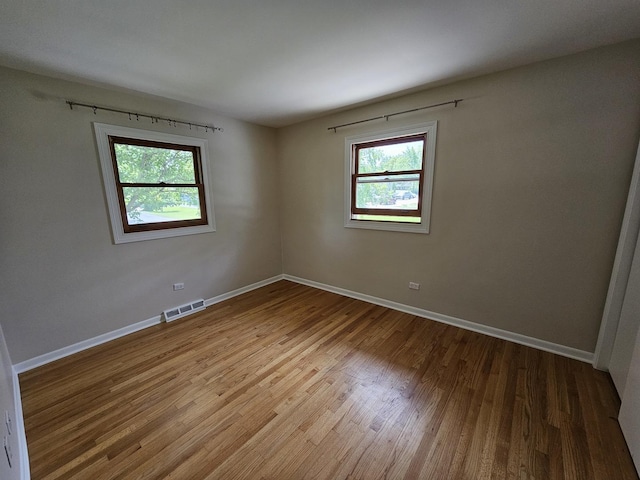 5S426 Columbia St, Naperville, IL 60563 - unfurnished room featuring healthy amount of natural light, wood finished floors, and baseboards