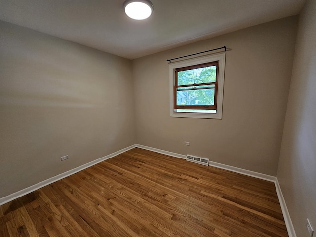 5S426 Columbia St, Naperville, IL 60563 - unfurnished room featuring baseboards and wood finished floors