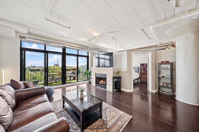 1524 S Sangamon St Unit 512, Chicago, IL 60608 - living area with wood finished floors, track lighting, a fireplace, and baseboards
