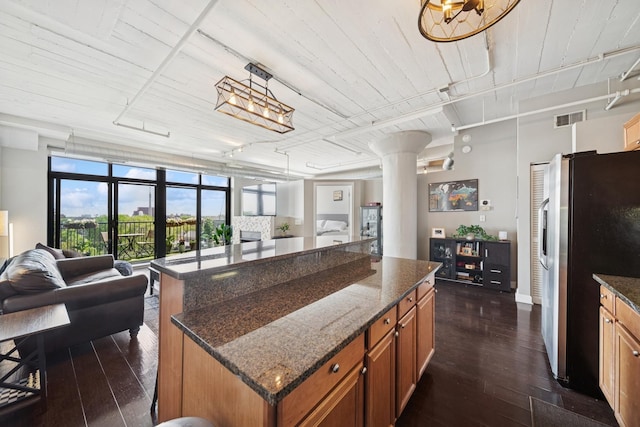 1524 S Sangamon St Unit 512, Chicago, IL 60608 - kitchen featuring open floor plan, stainless steel fridge, brown cabinetry, and wooden ceiling