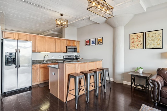 1524 S Sangamon St Unit 512, Chicago, IL 60608 - kitchen featuring stainless steel appliances, a sink, dark wood-type flooring, and a kitchen island