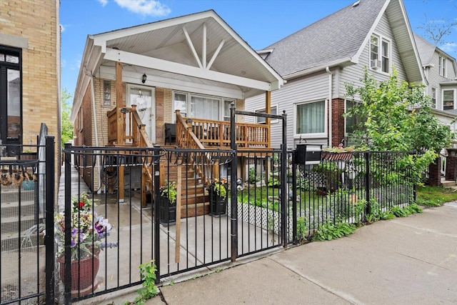 5642 W Dakin St, Chicago, IL 60634 - view of front of home featuring brick siding, covered porch, a fenced front yard, and stairs