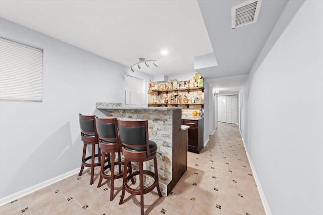 5642 W Dakin St, Chicago, IL 60634 - indoor bar featuring light tile patterned flooring, baseboards, and recessed lighting