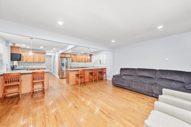 5642 W Dakin St, Chicago, IL 60634 - living area featuring recessed lighting, light wood-type flooring, and baseboards