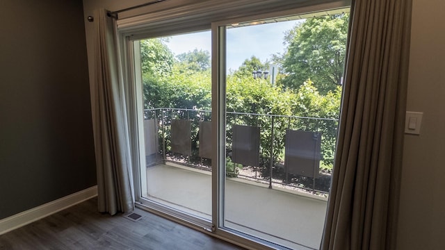 8210 Elmwood Ave Unit 106, Skokie, IL 60077 - doorway featuring wood finished floors and baseboards