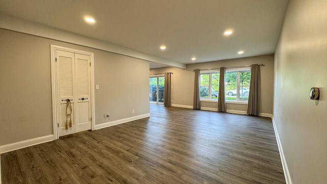 8210 Elmwood Ave Unit 106, Skokie, IL 60077 - spare room featuring recessed lighting, baseboards, and dark wood-style floors