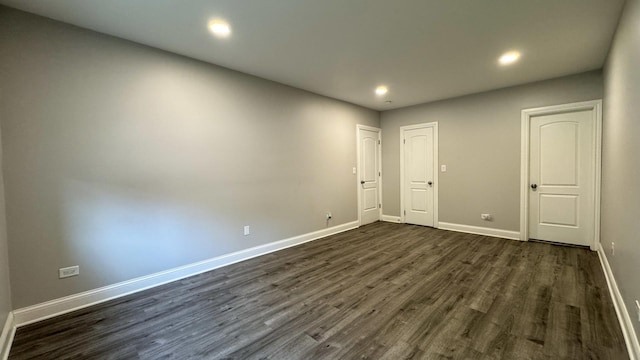 8210 Elmwood Ave Unit 106, Skokie, IL 60077 - spare room featuring baseboards, dark wood-type flooring, and recessed lighting