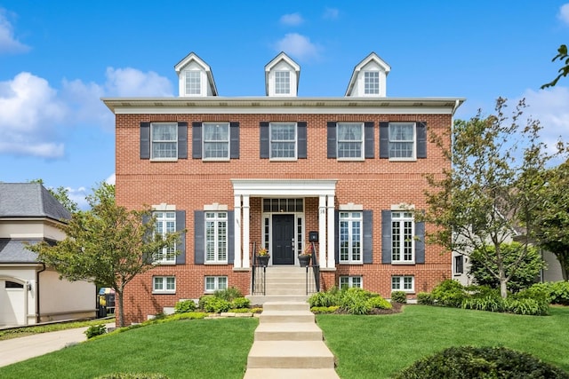 16 Tuttle Ave, Clarendon Hills, IL 60514 - colonial inspired home with a front yard and brick siding