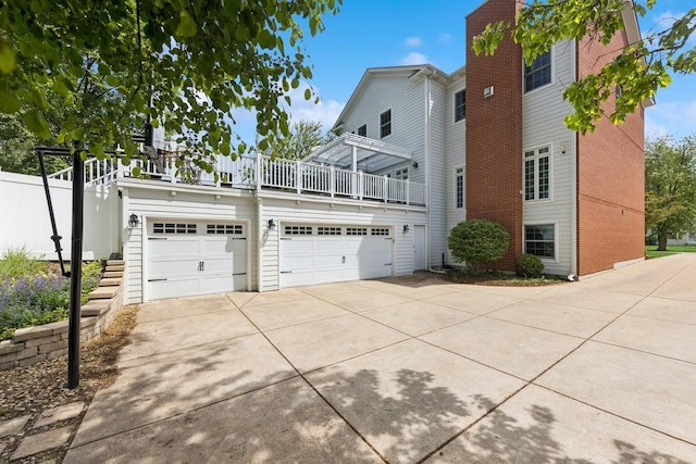 16 Tuttle Ave, Clarendon Hills, IL 60514 - view of side of property featuring driveway and an attached garage