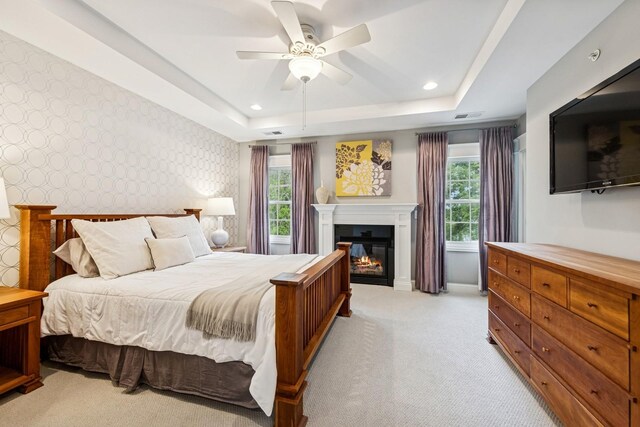 16 Tuttle Ave, Clarendon Hills, IL 60514 - bedroom with light carpet, multiple windows, recessed lighting, a glass covered fireplace, and wallpapered walls